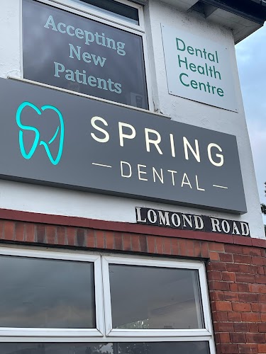 Spring Dental Clinic logo